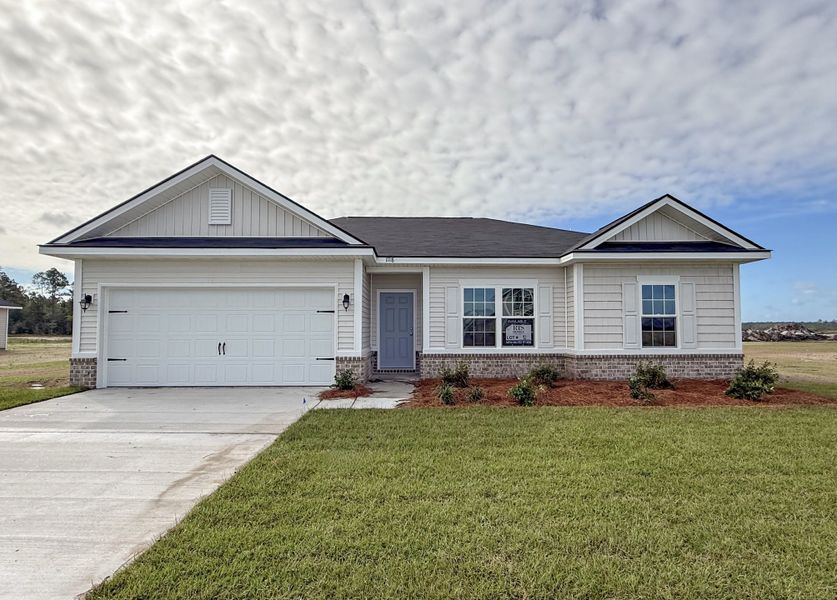 Front exterior of a new home in The Village at Sassafras, Allenhurst, GA, highlighting curb appeal (Image 1). Front exterior of a new home in The Village at Sassafras, Allenhurst, GA, highlighting curb appeal (Image 1).