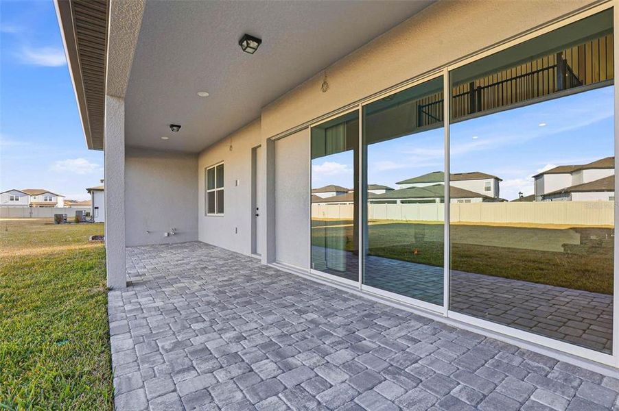 Exterior details and patio area of a home in Vida's Way, Wesley Chapel (Image 28).