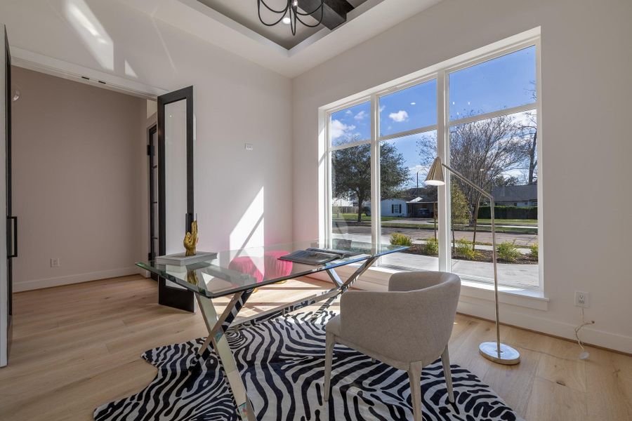 Private first-floor bedroom or executive home office with large windows and flexible functionality.