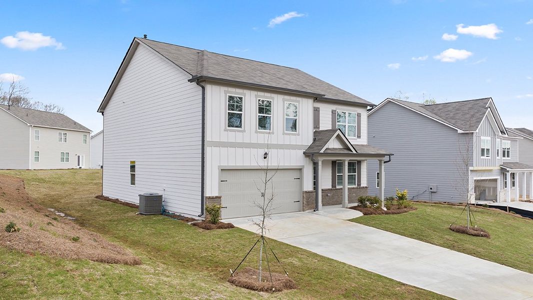 Representative exterior photo of a completed home built from the Hanover by D.R. Horton in Thompson Ridge, Dallas, GA (Image 18).