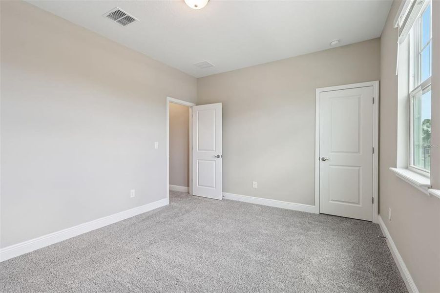 Spacious, unfurnished interior of a new home in Legends Preserve - Signature Series, Daytona Beach (Image 39).