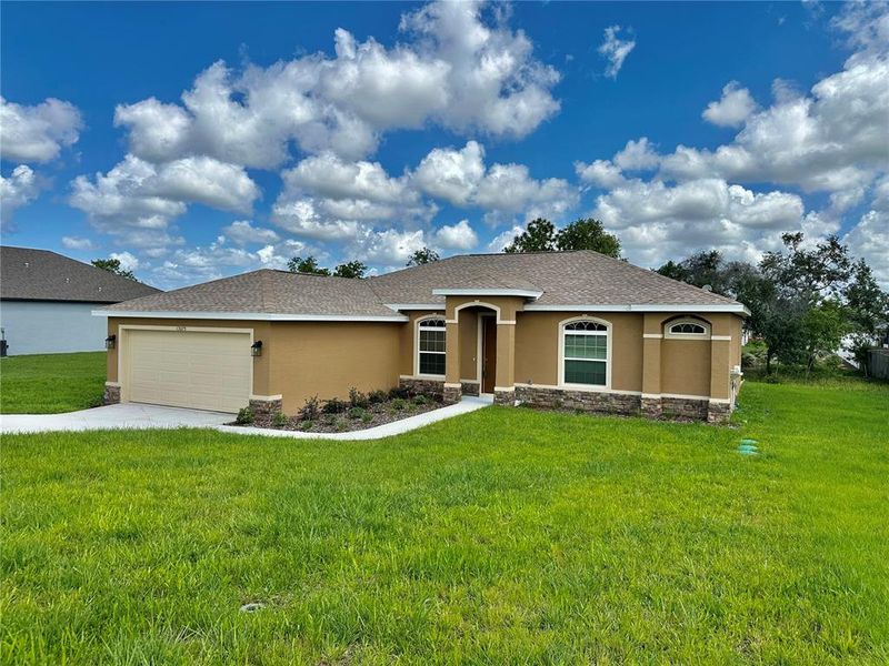 Front exterior of a new home in , Weeki Wachee, FL, highlighting curb appeal (Image 28).
