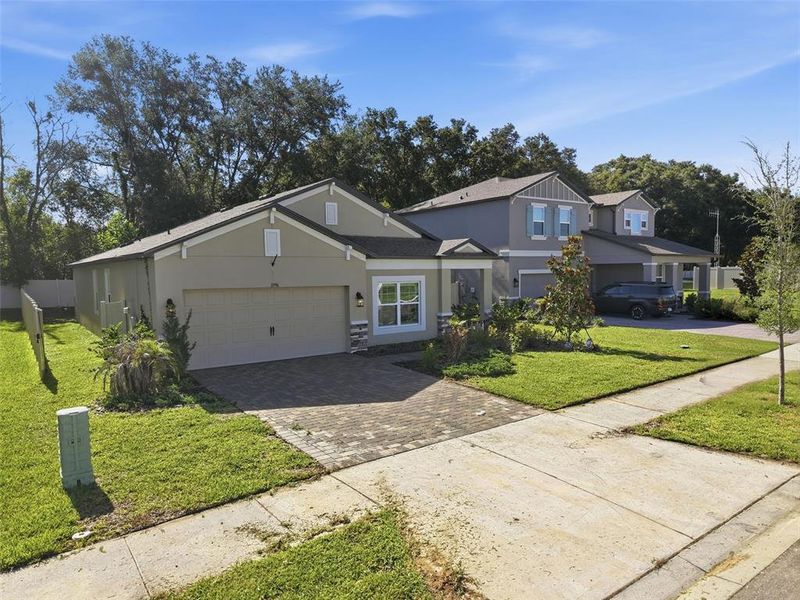 Front exterior of a new home in Hilltop Point, Dade City, FL, highlighting curb appeal (Image 27). Front exterior of a new home in Hilltop Point, Dade City, FL, highlighting curb appeal (Image 27).
