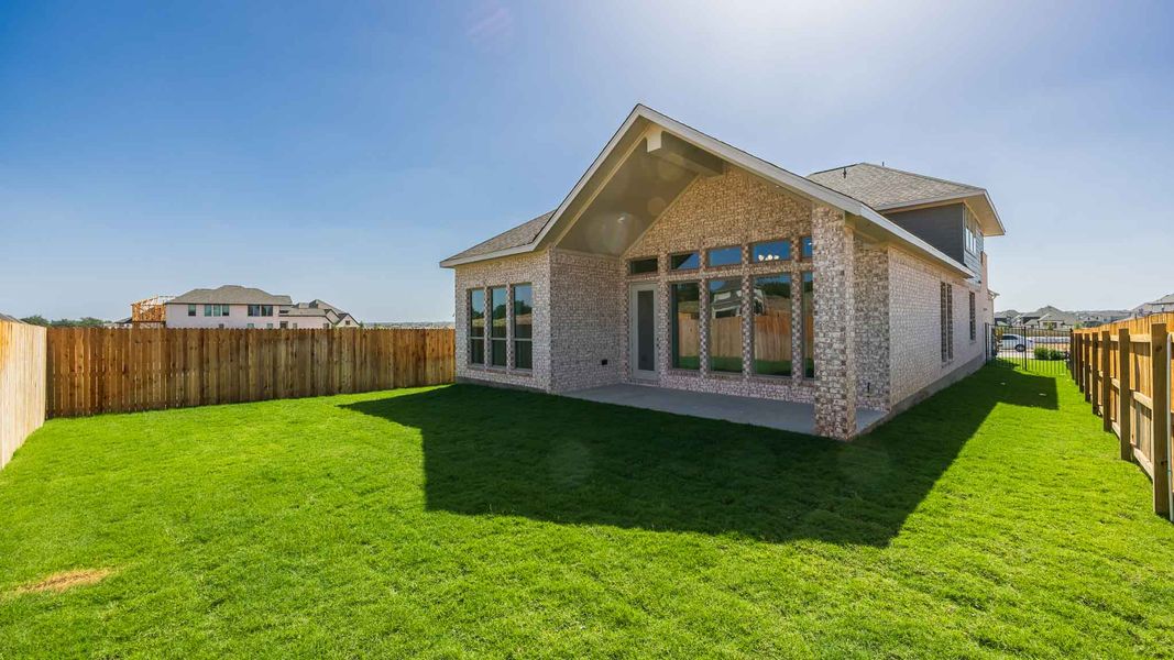 Exterior details and patio area of a home in Santa Rita Ranch - Tierra Rosa, Liberty Hill (Image 2). Exterior details and patio area of a home in Santa Rita Ranch - Tierra Rosa, Liberty Hill (Image 2).