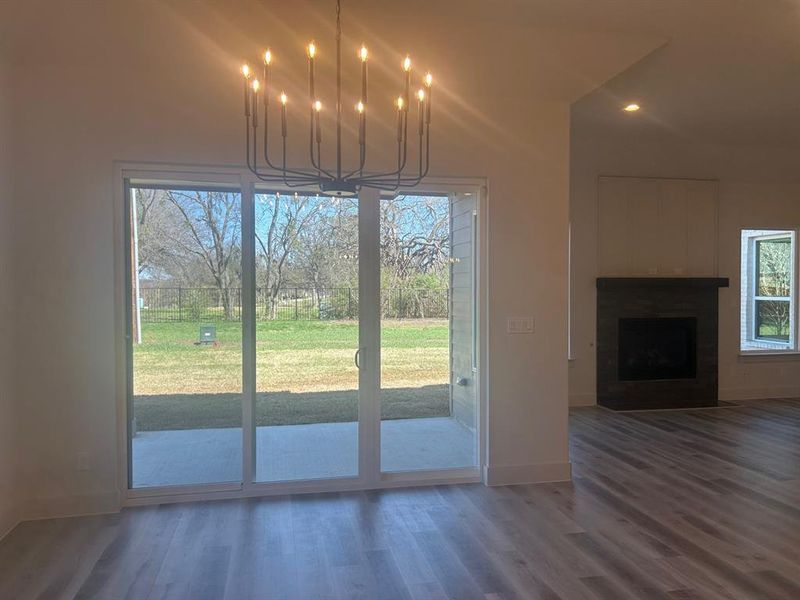 Large dining area with sliding door to back patio and fenced backyard