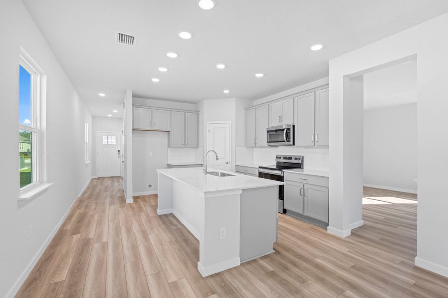 Lot 23 Kitchen with Gray Cabinets at Camden Woods in Kingsland