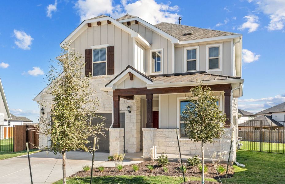 Front exterior of a new home in Santa Rita Ranch, Liberty Hill, TX, highlighting curb appeal (Image 24).