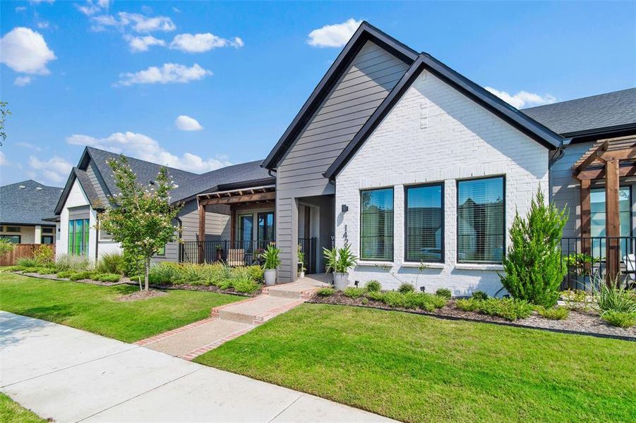Front exterior of a new home in , Arlington, TX, highlighting curb appeal (Image 2).