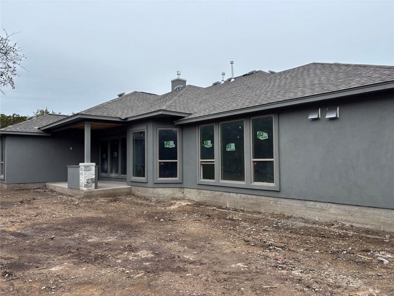 Exterior details and patio area of a home in The Hollows on Lake Travis, Leander (Image 22).