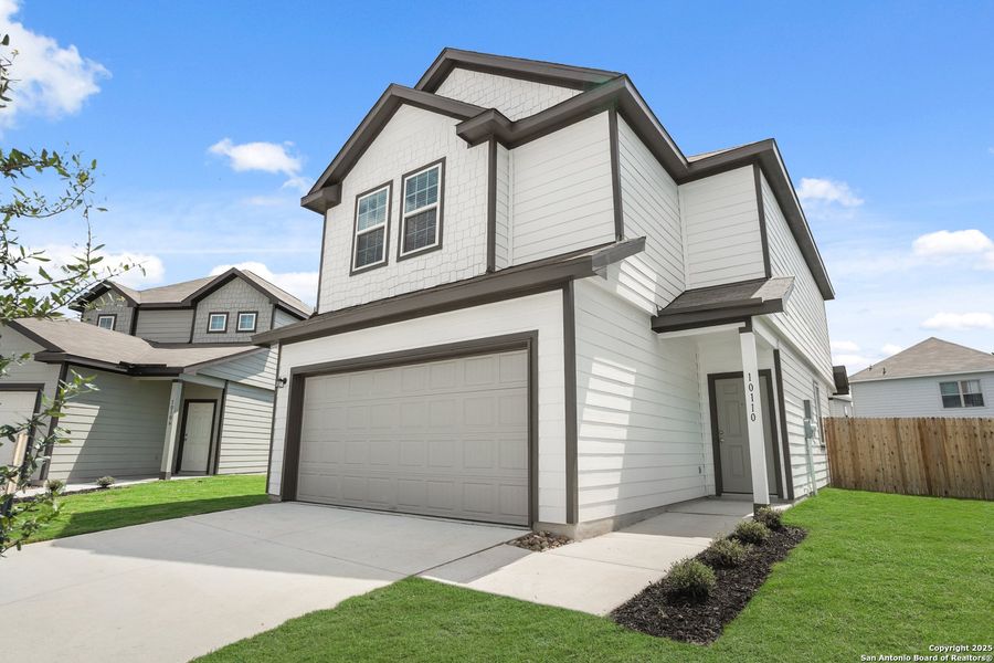Front exterior of a new home in Melissa Ranch, San Antonio, TX, highlighting curb appeal (Image 1). Front exterior of a new home in Melissa Ranch, San Antonio, TX, highlighting curb appeal (Image 1).