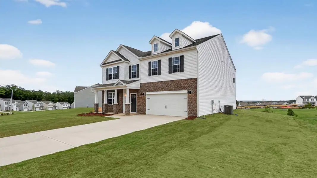 Front exterior of a new home in North Gate, Vass, NC, highlighting curb appeal (Image 1). Front exterior of a new home in North Gate, Vass, NC, highlighting curb appeal (Image 1).