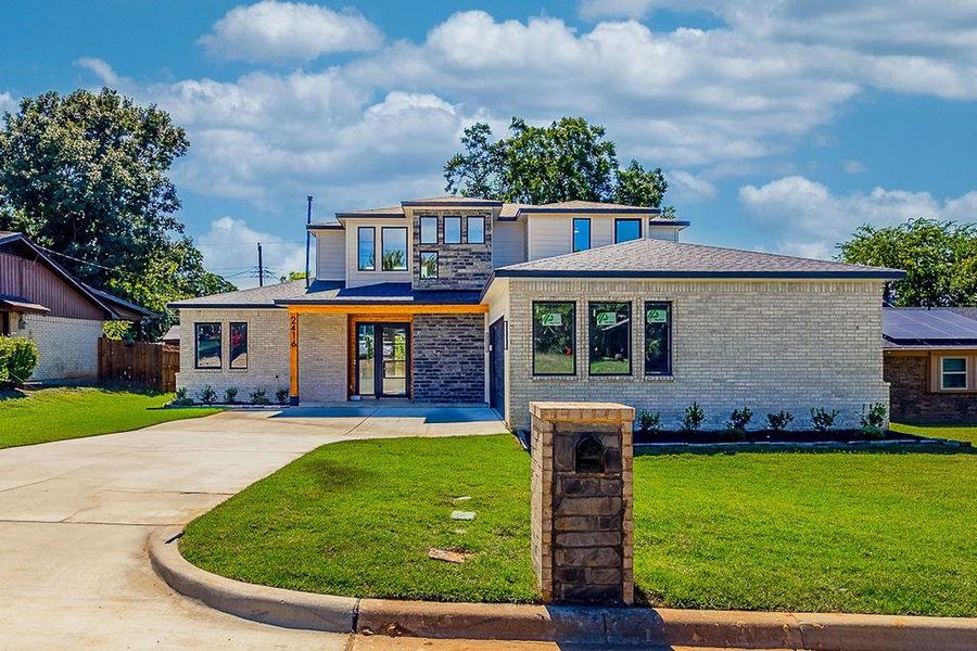 Front exterior of a new home in , Arlington, TX, highlighting curb appeal (Image 19). Front exterior of a new home in , Arlington, TX, highlighting curb appeal (Image 19).