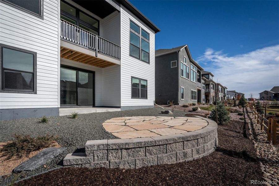 Exterior details and patio area of a home in Cloverleaf - Pinnacle Collection, Monument (Image 25).