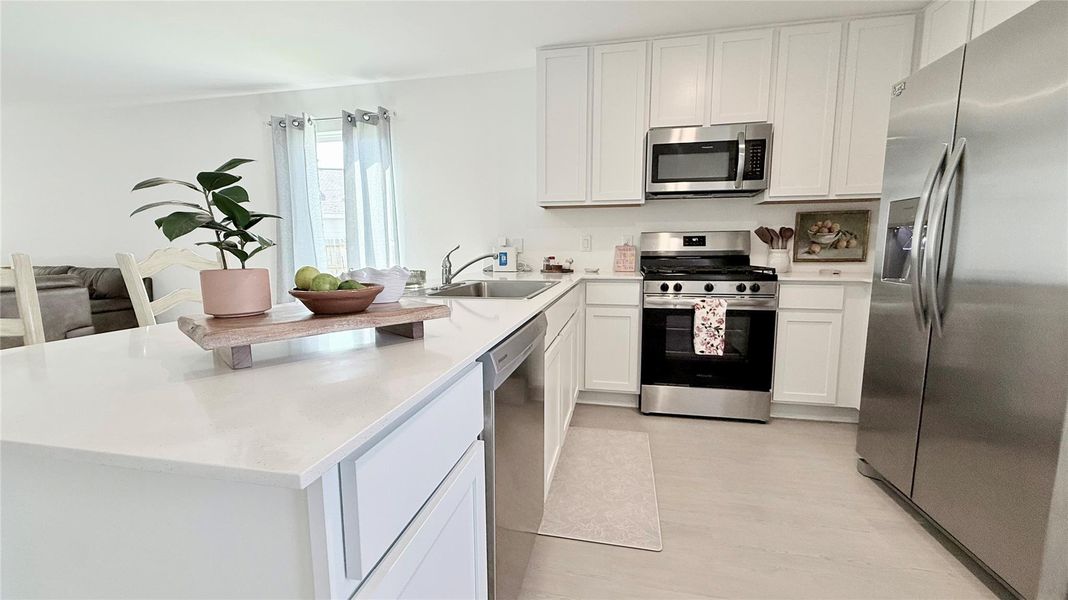 Another view of the beautiful and elegant kitchen. Take a look of the modern stainless steel refrigerator, dishwasher, gas range, and microwave - all included with your purchase! Another view of the beautiful and elegant kitchen. Take a look of the modern stainless steel refrigerator, dishwasher, gas range, and microwave - all included with your purchase!