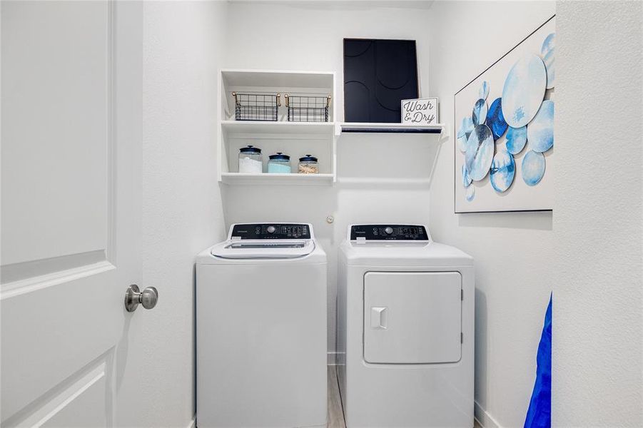 Laundry area featuring washer and clothes dryer