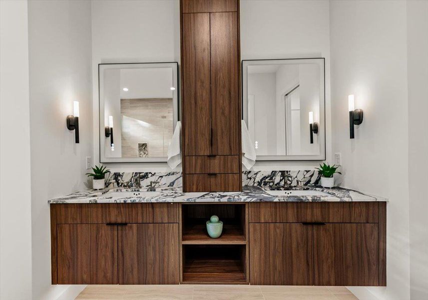 Floating vanity with. motion activated lighting in primary bathroom.