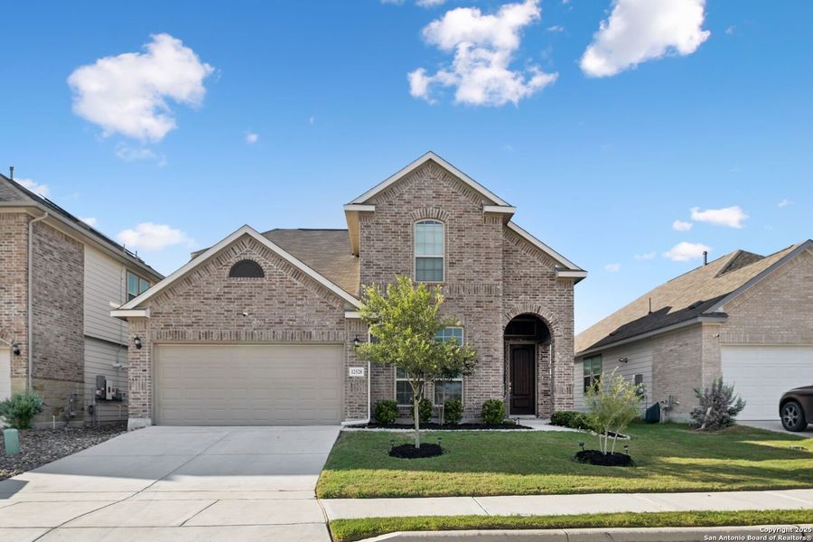 Front exterior of a new home in Rhine Valley, Schertz, TX, highlighting curb appeal (Image 27).