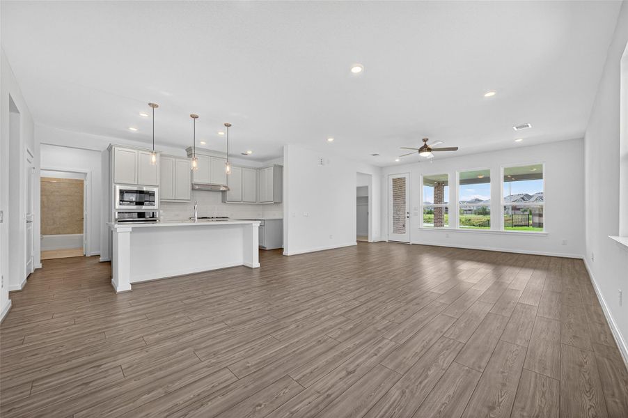 The kitchen is perfectly positioned at the heart of the home, overlooking the spacious living area for easy entertaining and everyday connection.
