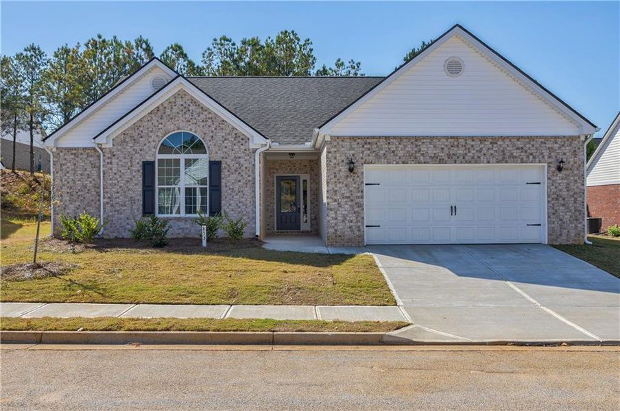 Front exterior of a new home in , Social Circle, GA, highlighting curb appeal (Image 1).