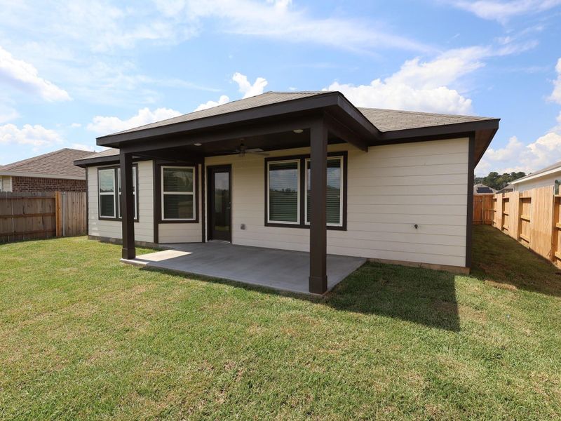 Front exterior of a new home in Pinewood at Grand Texas, New Caney, TX, highlighting curb appeal (Image 1). Front exterior of a new home in Pinewood at Grand Texas, New Caney, TX, highlighting curb appeal (Image 1).