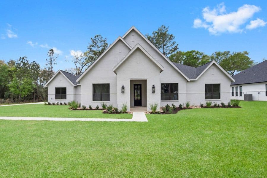 Representative exterior photo of a completed home built from the 3015 by Gracepoint Homes in Chapel Bend, Montgomery, TX (Image 2). Representative exterior photo of a completed home built from the 3015 by Gracepoint Homes in Chapel Bend, Montgomery, TX (Image 2).