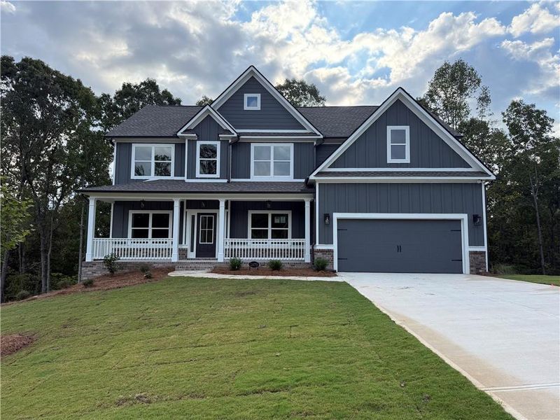 Front exterior of a new home in , Loganville, GA, highlighting curb appeal (Image 1). Front exterior of a new home in , Loganville, GA, highlighting curb appeal (Image 1).