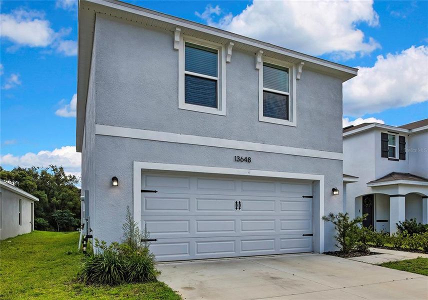 Front exterior of a new home in Heritage Hills, Dade City, FL, highlighting curb appeal (Image 2). Front exterior of a new home in Heritage Hills, Dade City, FL, highlighting curb appeal (Image 2).