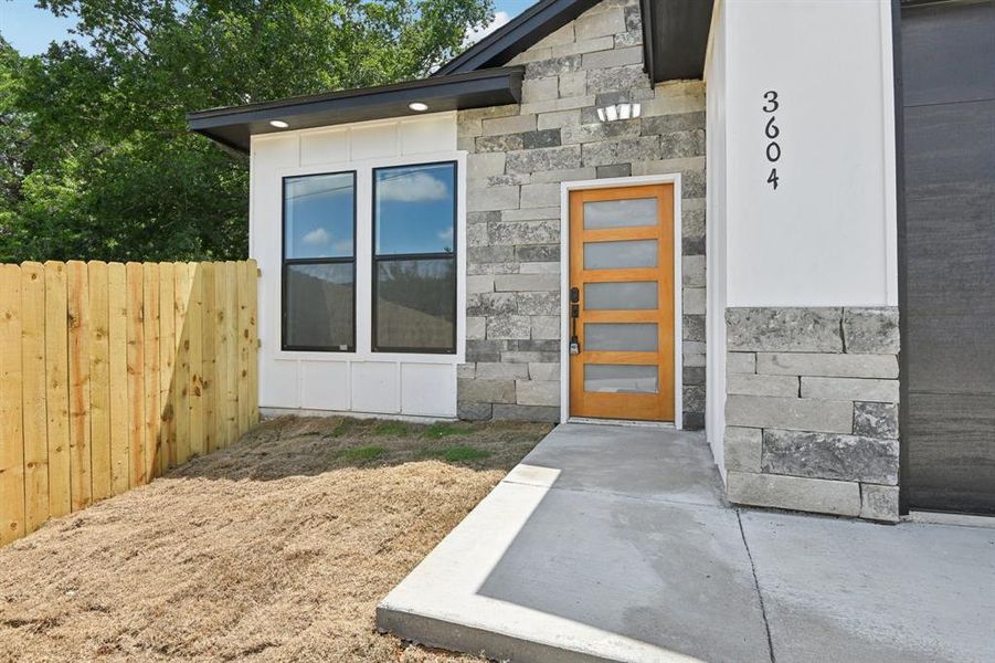 View of exterior entry featuring stone siding View of exterior entry featuring stone siding