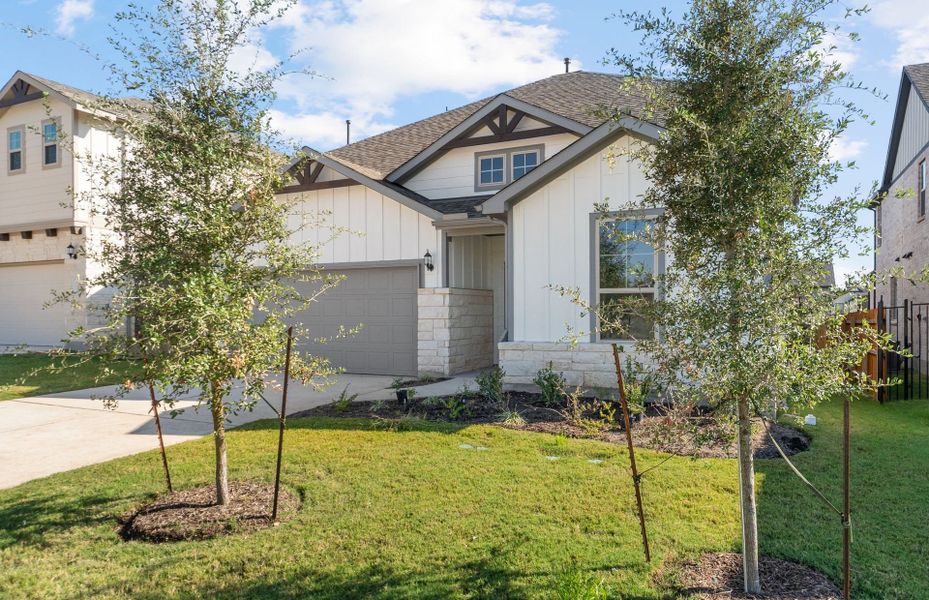 Front exterior of a new home in Saddleback at Santa Rita Ranch, Liberty Hill, TX, highlighting curb appeal (Image 20).