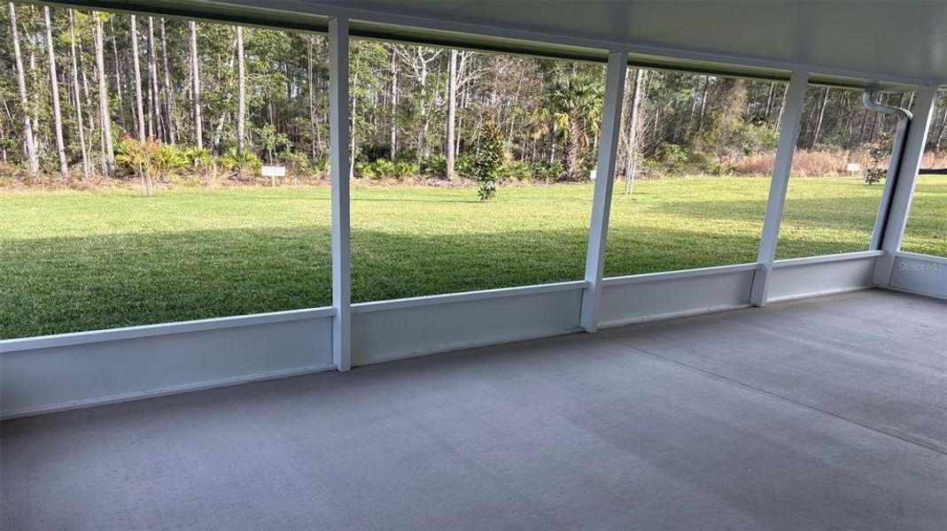 Exterior details and patio area of a home in Enclave At Seminole Palms, Palm Coast (Image 3).