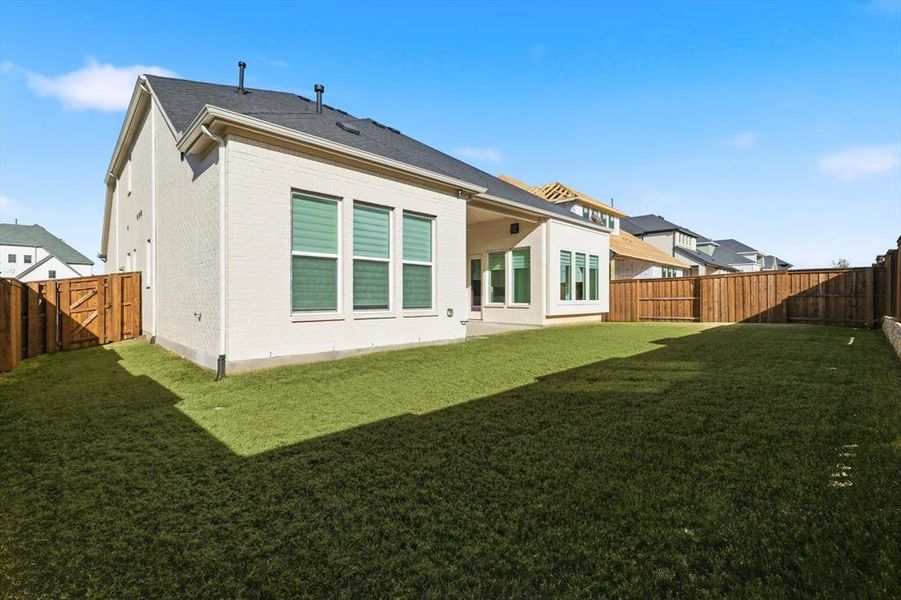 Exterior details and patio area of a home in Windsong Ranch 61' Series, Prosper (Image 3).