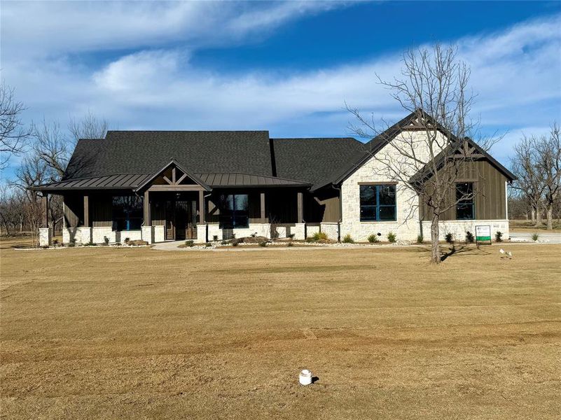 Front exterior of a new home in , Granbury, TX, highlighting curb appeal (Image 34). Front exterior of a new home in , Granbury, TX, highlighting curb appeal (Image 34).