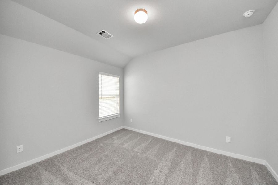 Secondary bedroom features plush carpeting, large windows that let in plenty of natural light, bright paint, and spacious closets. Secondary bedroom features plush carpeting, large windows that let in plenty of natural light, bright paint, and spacious closets.