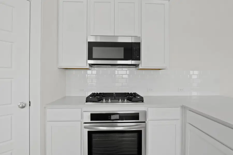 Kitchen in the Pecan II home plan by Trophy Signature Homes – REPRESENTATIVE PHOTO Kitchen in the Pecan II home plan by Trophy Signature Homes – REPRESENTATIVE PHOTO