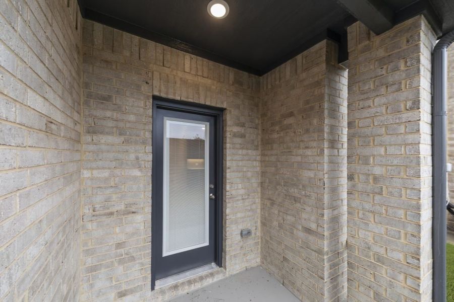 Front exterior of a new home in Sereno Oaks at Buckner Terrace, Dallas, TX, highlighting curb appeal (Image 27).