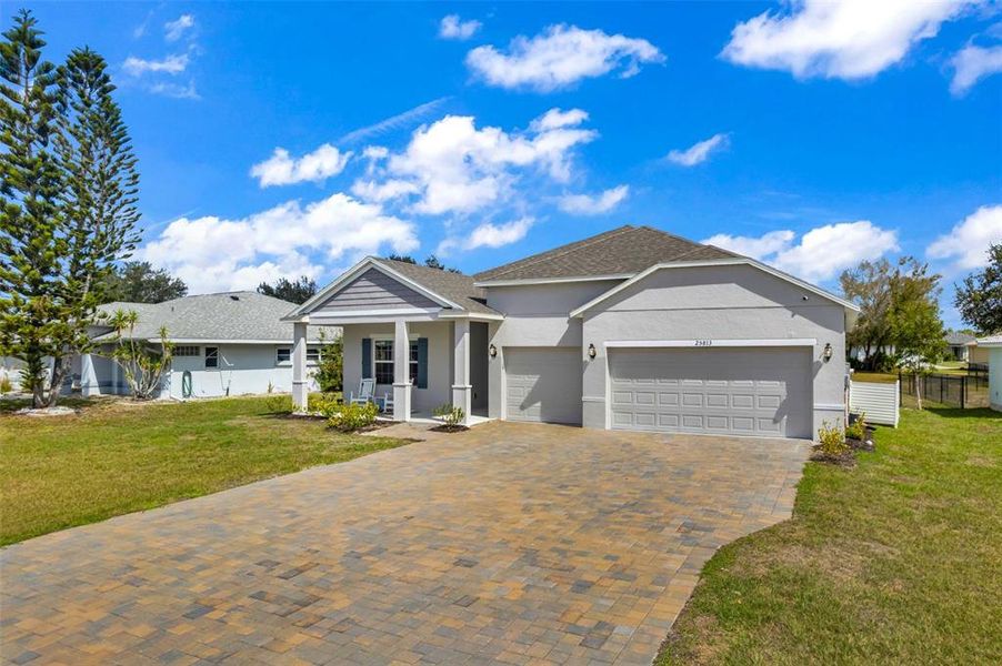 Front exterior of a new home in , Punta Gorda, FL, highlighting curb appeal (Image 25).
