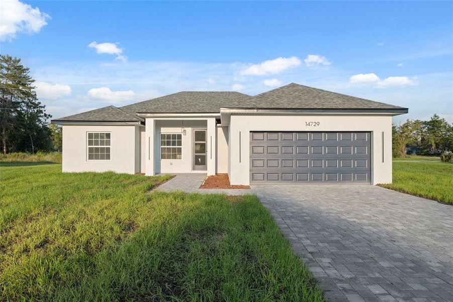 Front exterior of a new home in , Ocala, FL, highlighting curb appeal (Image 18). Front exterior of a new home in , Ocala, FL, highlighting curb appeal (Image 18).