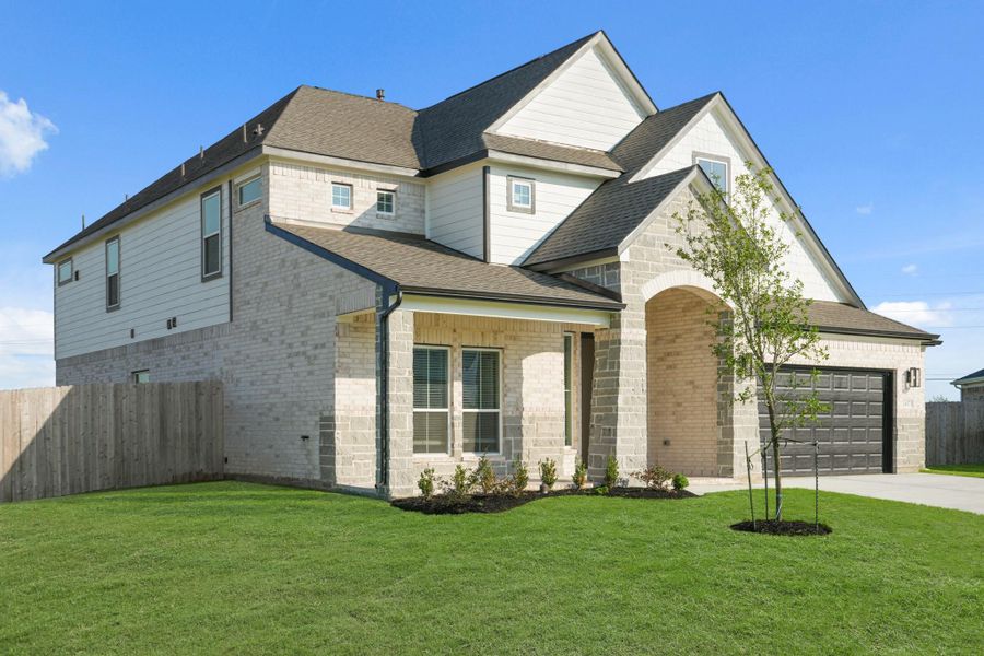 Front exterior of a new home in Beacon Hill, Waller, TX, highlighting curb appeal (Image 13). Front exterior of a new home in Beacon Hill, Waller, TX, highlighting curb appeal (Image 13).