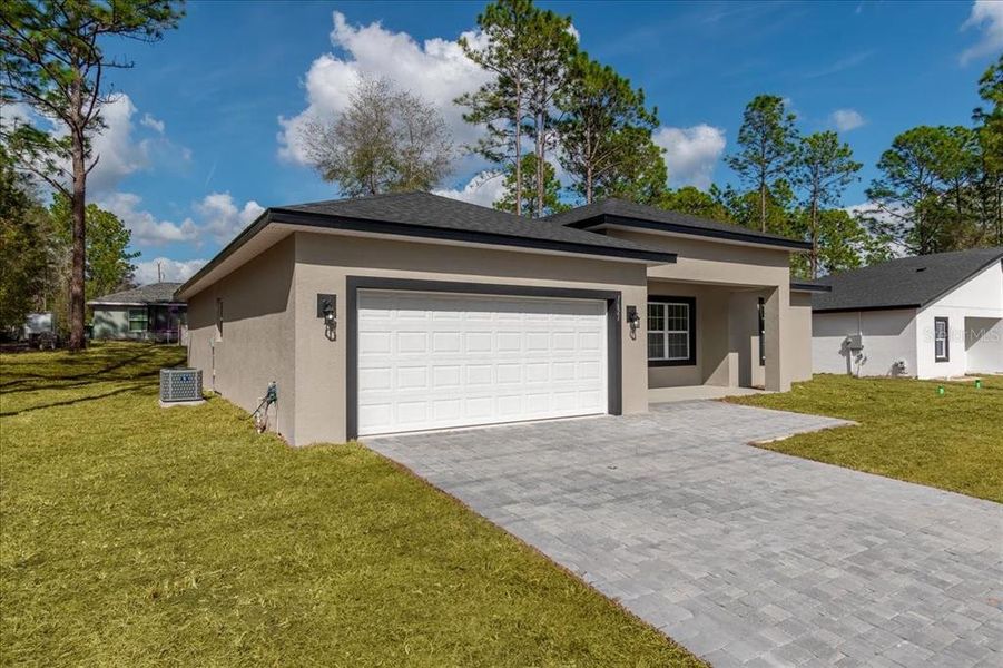 Front exterior of a new home in , Citrus Springs, FL, highlighting curb appeal (Image 28).