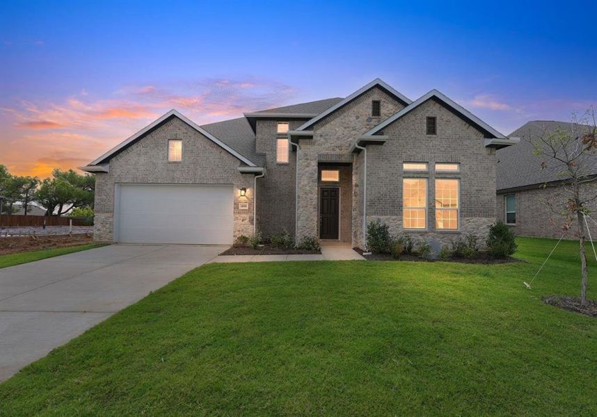 Front exterior of a new home in Legacy Estates, Mansfield, TX, highlighting curb appeal (Image 14). Front exterior of a new home in Legacy Estates, Mansfield, TX, highlighting curb appeal (Image 14).