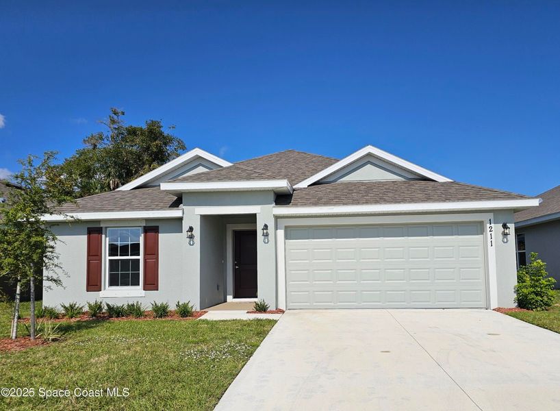 Front exterior of a new home in Hickory Ridge, Cocoa, FL, Cocoa, FL, highlighting curb appeal (Image 1).