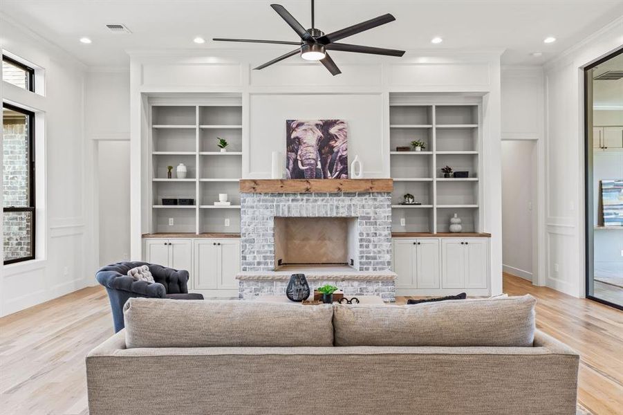 Custom Built In Bookshelves with Lowers and Counter Top surround the Gas Assist Woodburing Fireplace