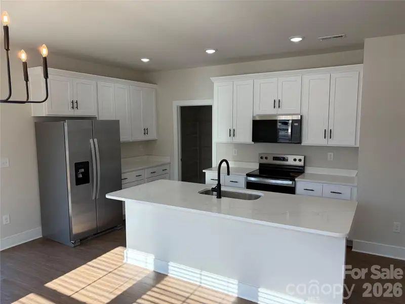 Furnished interior view inside a new home in , Lenoir (Image 3).