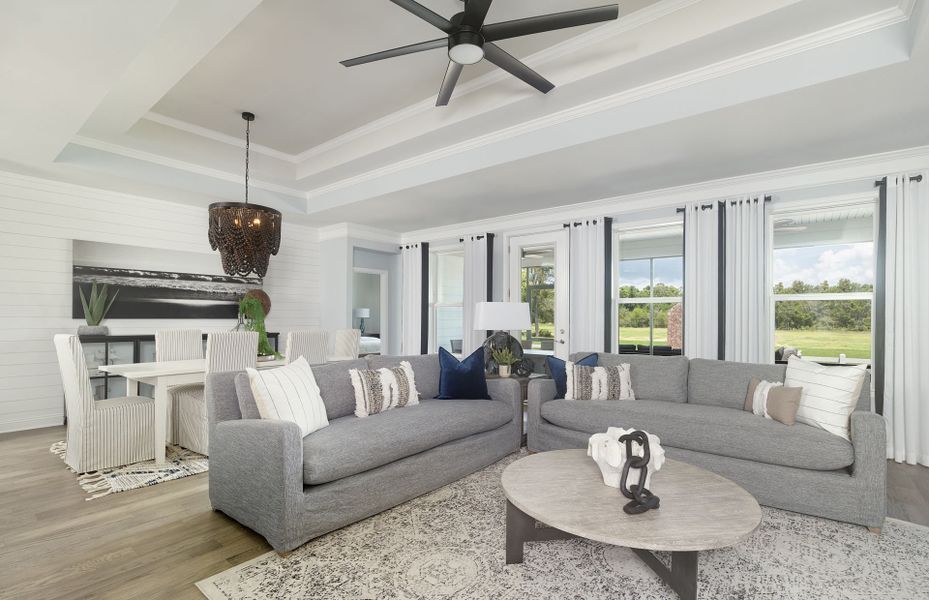 Relaxing Gathering Room with hardwood floors and plenty of space to entertain guests.