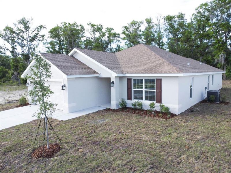 Front exterior of a new home in , Ocala, FL, highlighting curb appeal (Image 14).