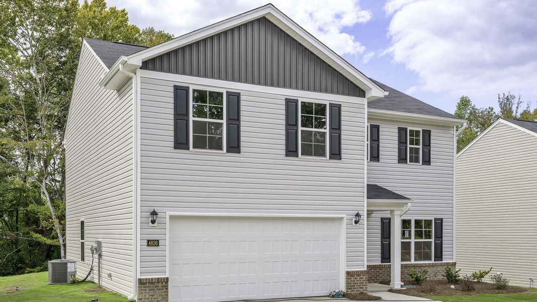 Front exterior of a new home in Mount Hope Estates, Winston-Salem, NC, highlighting curb appeal (Image 2). Front exterior of a new home in Mount Hope Estates, Winston-Salem, NC, highlighting curb appeal (Image 2).