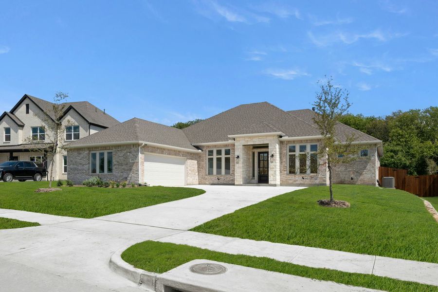 Front exterior of a new home in Kentsdale Farms, DeSoto, TX, highlighting curb appeal (Image 23).