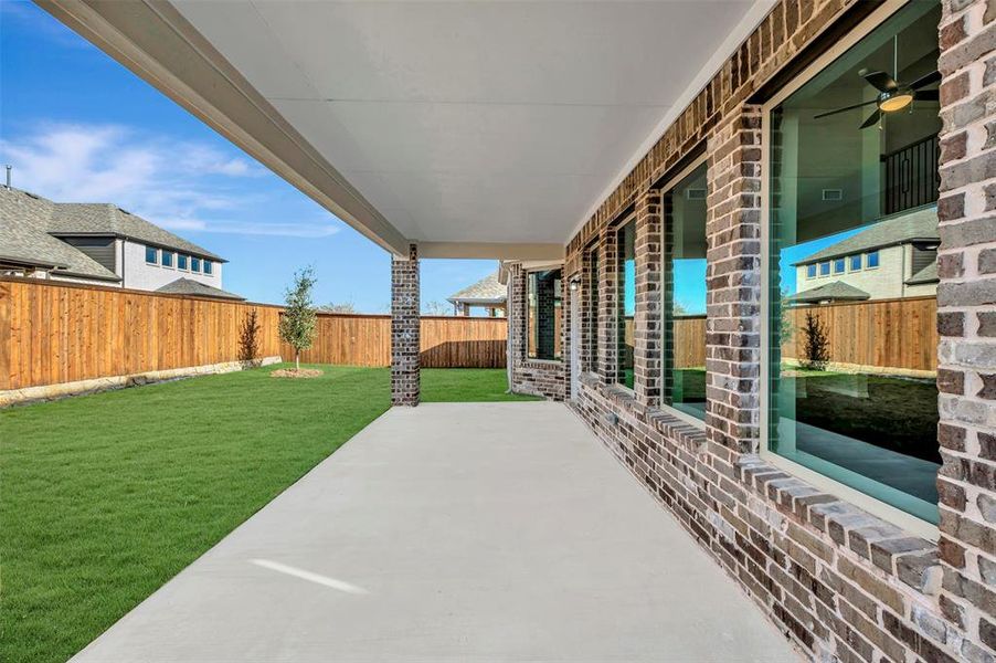 Exterior details and patio area of a home in Lily Creek at Sutton Fields, Aubrey (Image 23).