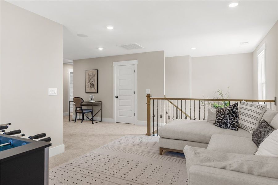 This versatile loft area offers a bright and invit