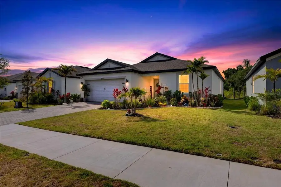 Front exterior of a new home in , Palmetto, FL, highlighting curb appeal (Image 26). Front exterior of a new home in , Palmetto, FL, highlighting curb appeal (Image 26).